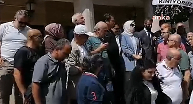 Erzurum'da gazetecilerin darp edilmesine KUDAKA binasına siyah çelenkli protesto